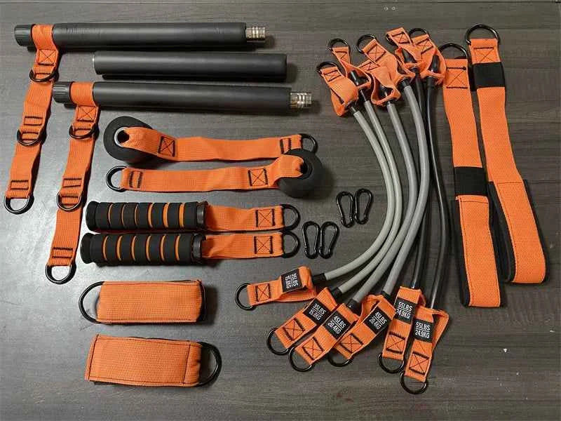 Orange and black resistance band Pilates set with bars, straps, and loop bands