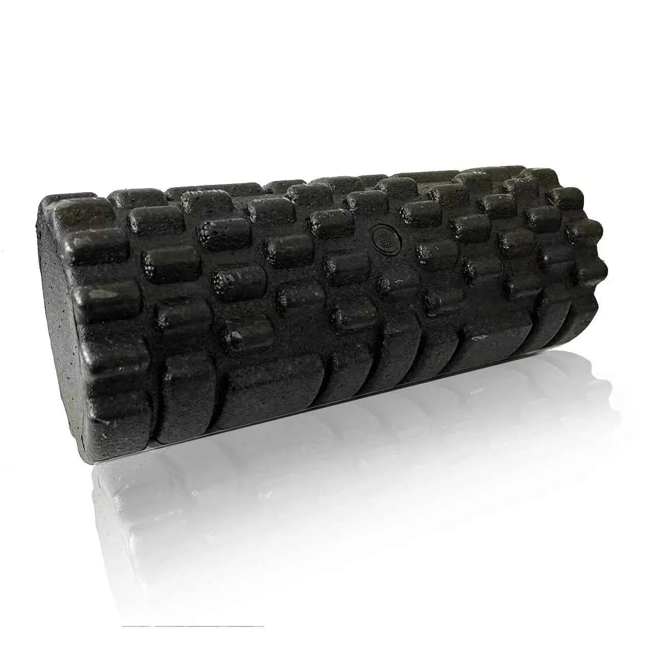 Black high density foam roller with textured massage surface, angled view