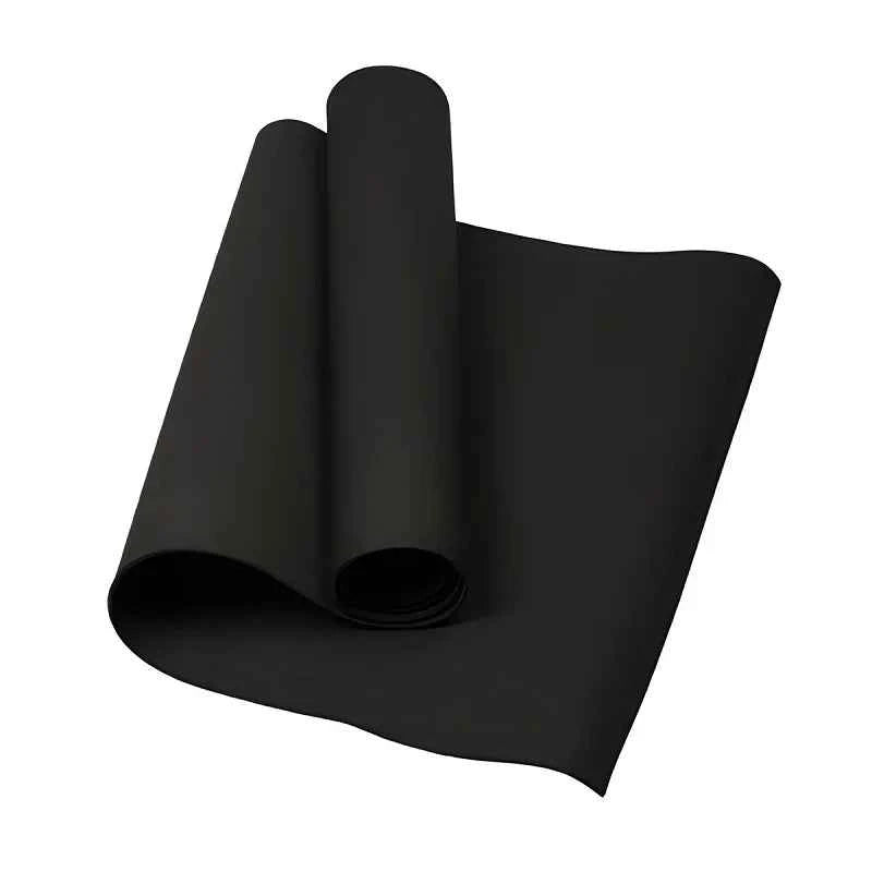 Black yoga mat rolled and stacked, non-slip textured surface