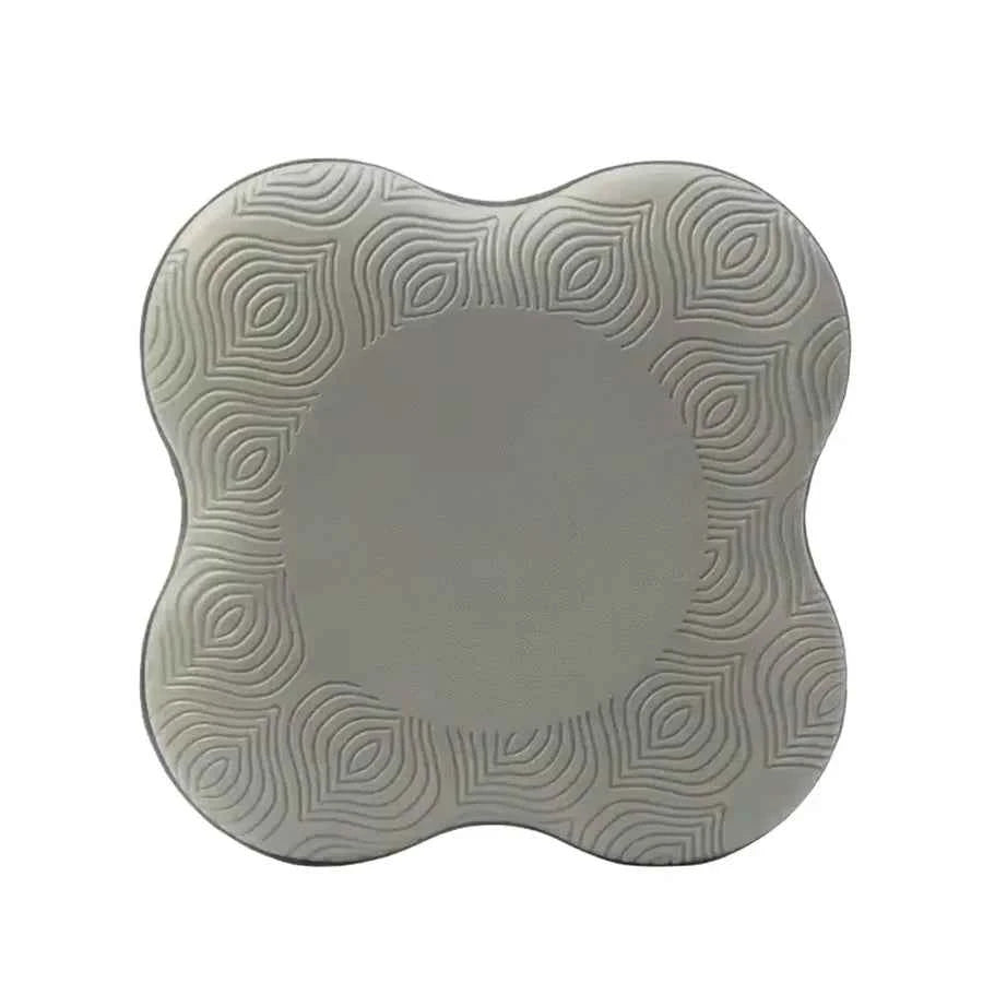 Grey yoga knee pad, heart-shaped cushion with raised spiral texture