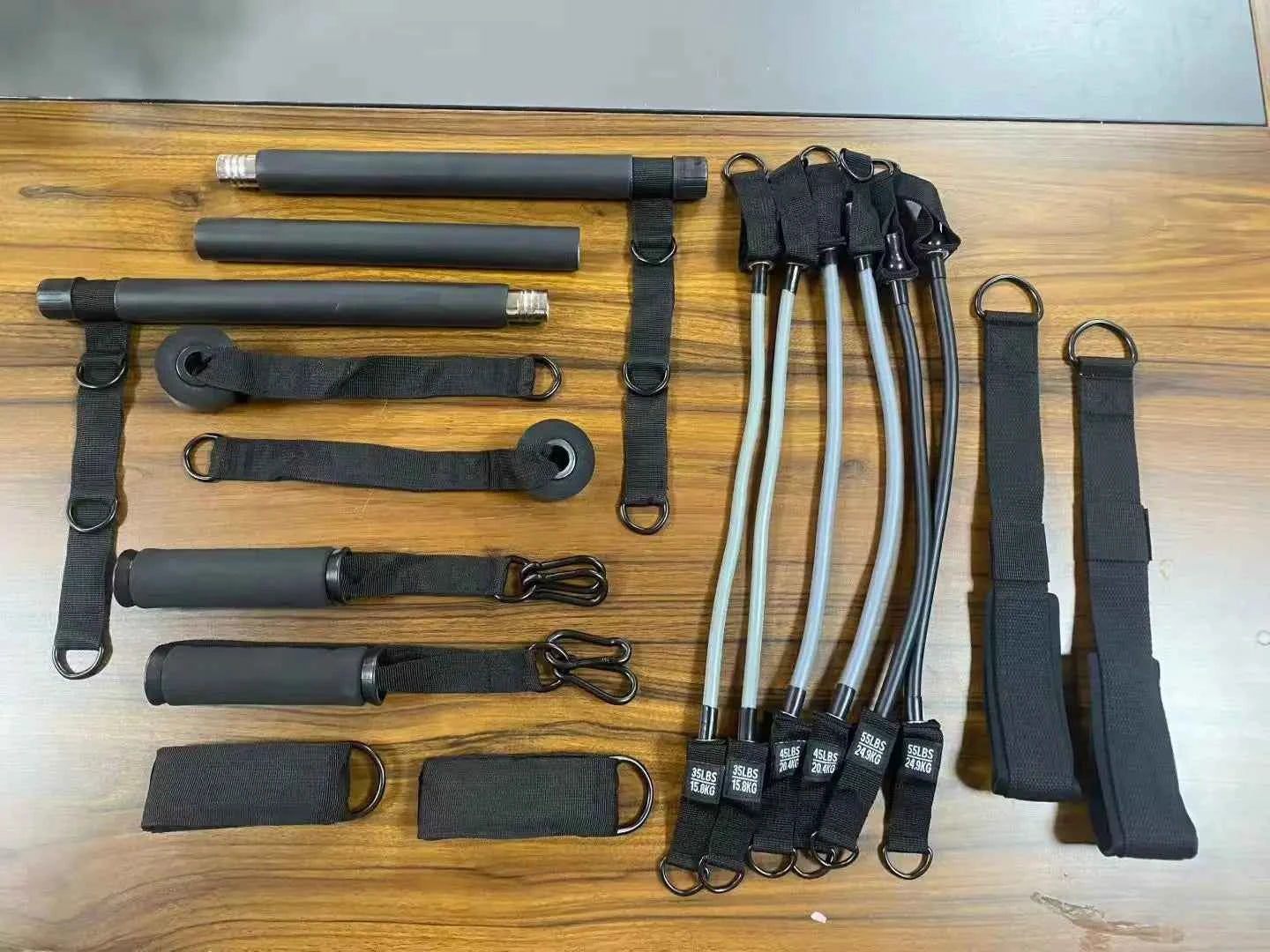 Black resistance band Pilates set with long bars and loop strap attachments