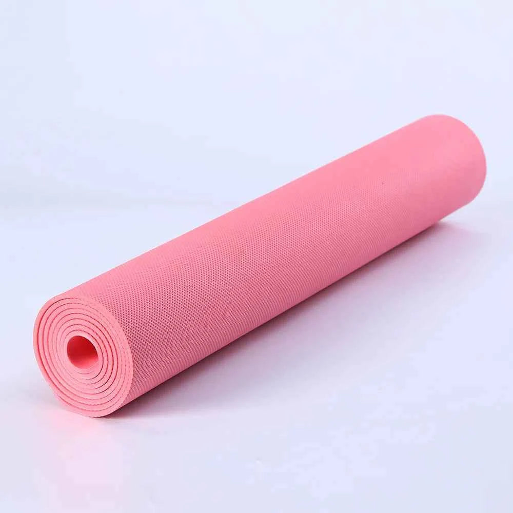 Pink PVC yoga mat roll with textured top and non-slip grip